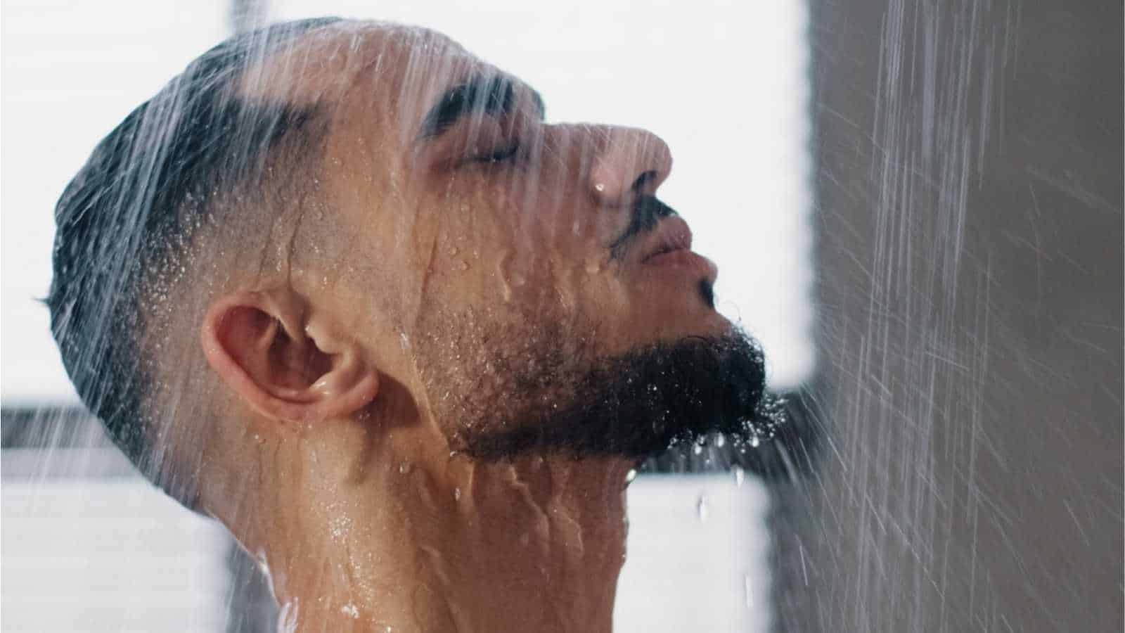 Man showering at gym