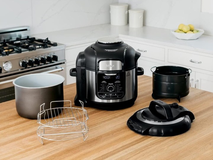 TheNinja FD401 LP3 Foodi 12-in-1 Deluxe XL 8 qt. Pressure Cooker & Air Fryer and its components on a kitchen counter.