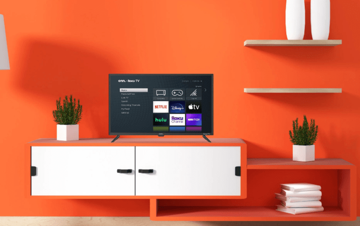 An onn. 32-inch Roku Smart TV on a cabinet in a living room.