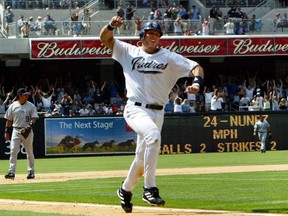 Padres' Sean Burroughs celebrates scoring the winning run off a hit by teammate Jay Payton during their win in the 10th inning over the Rockies in San Diego, June 2, 2004.