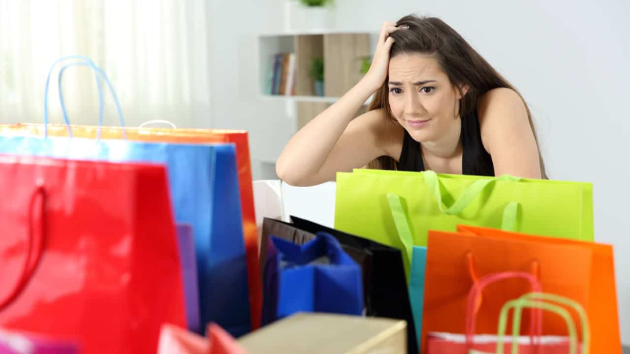 shopaholic woman after multiple purchases