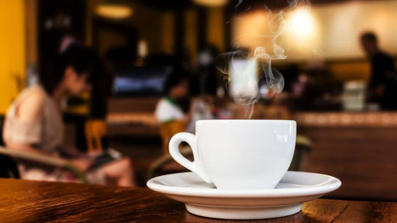 cup of coffee on table in cafe