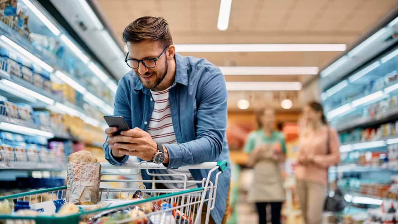 using mobile phone app while buying groceries