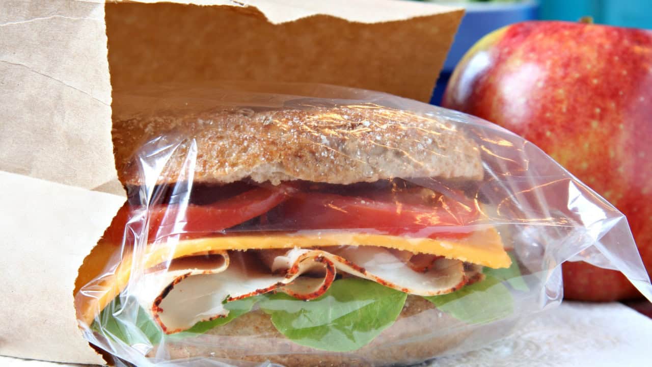 sandwich in a brown paper lunch bag