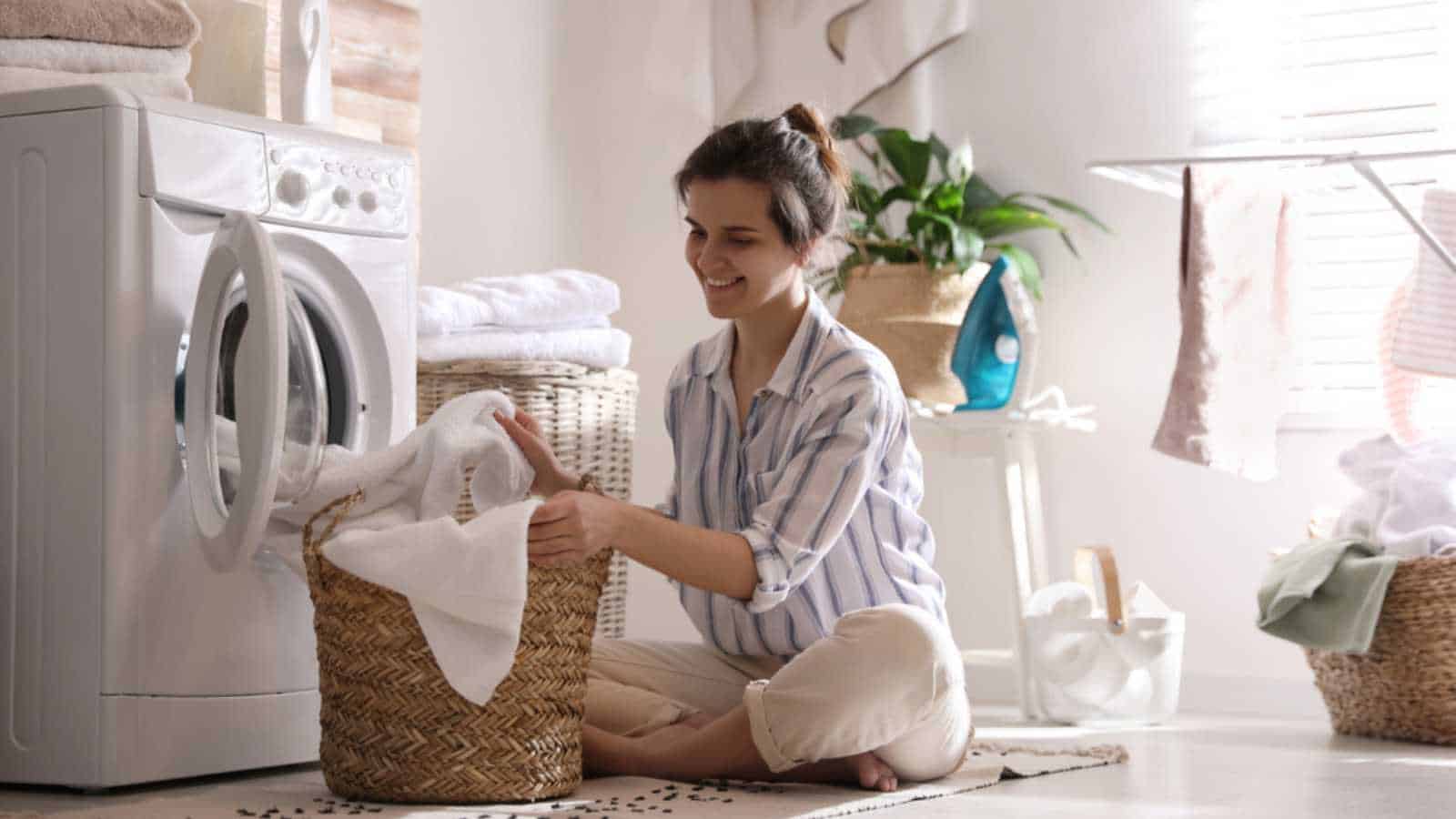 Woman using washing machine