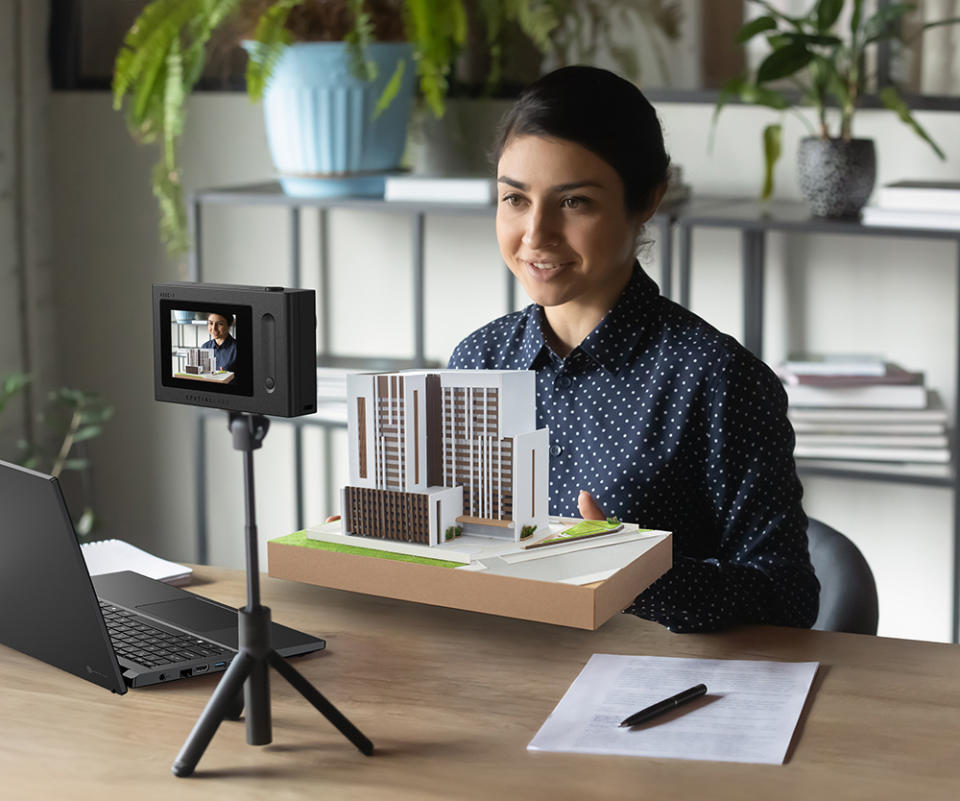 A person livestreaming with a camera in the foreground.