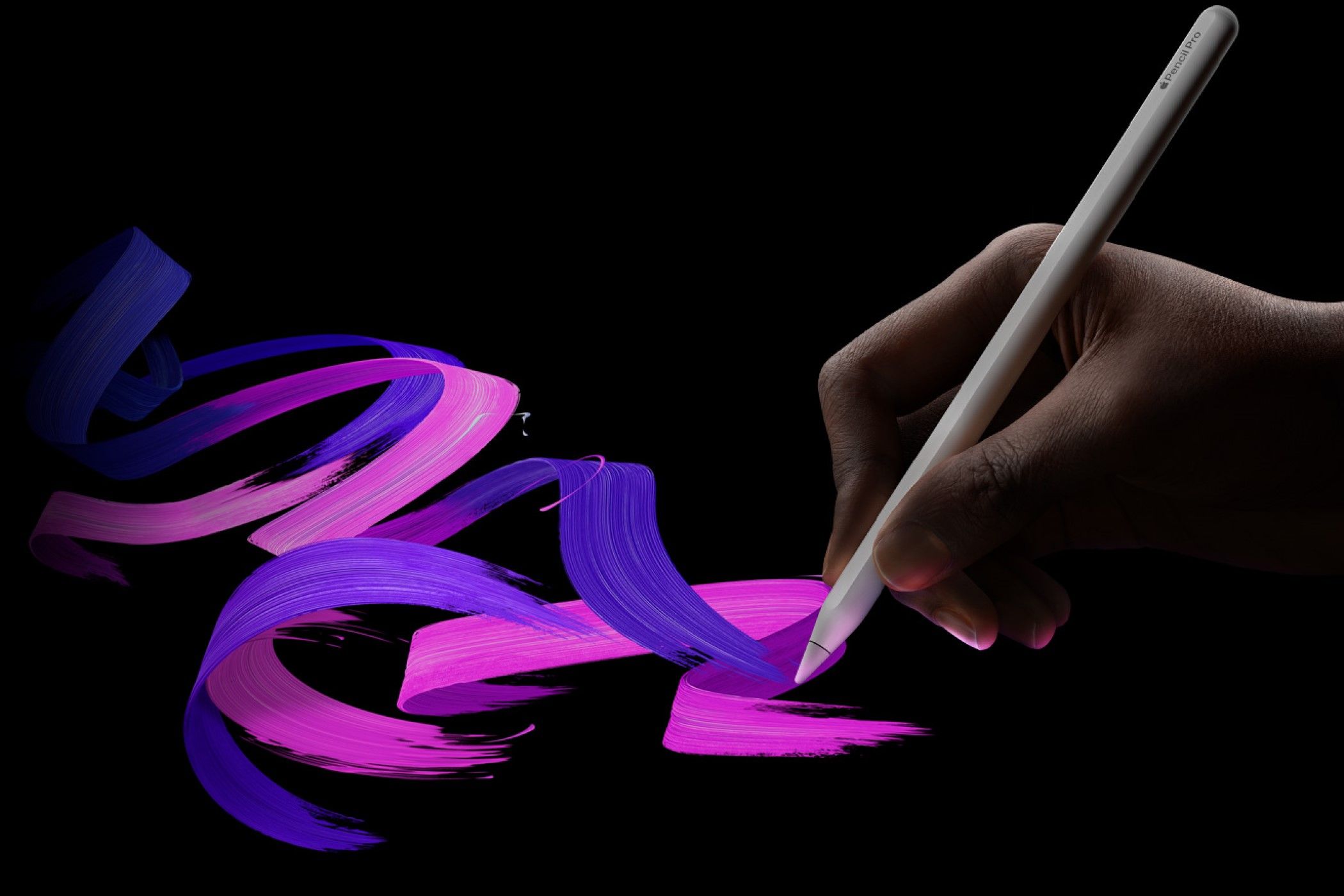 A person drawing with the Apple Pencil Pro. 