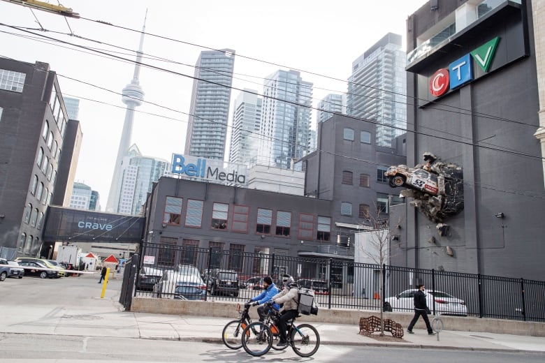 The Bell Media Studios, in downtown Toronto, are pictured on Feb. 8, 2024. See CTV building, signs, art installation of  CP24 truck smashing out of its wall and TO skyline in bg.