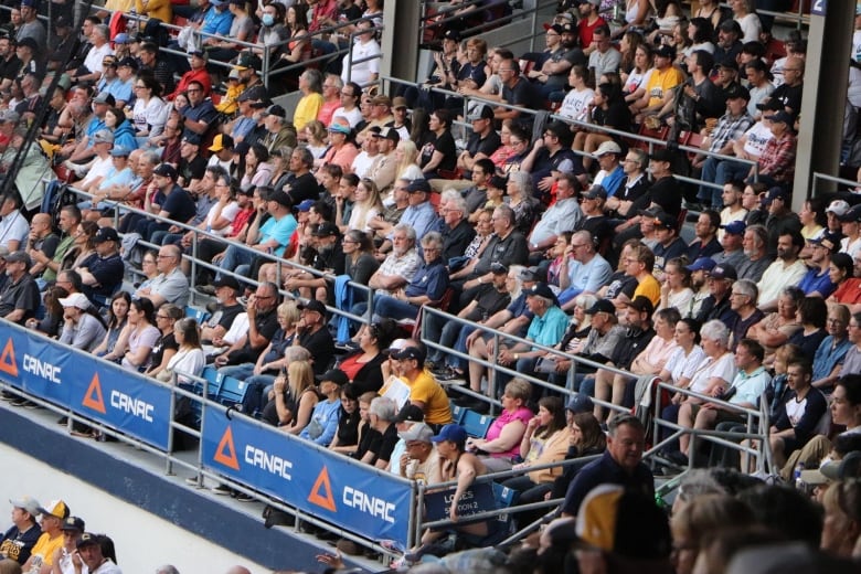 A picture of a crowd seaated in a stadium