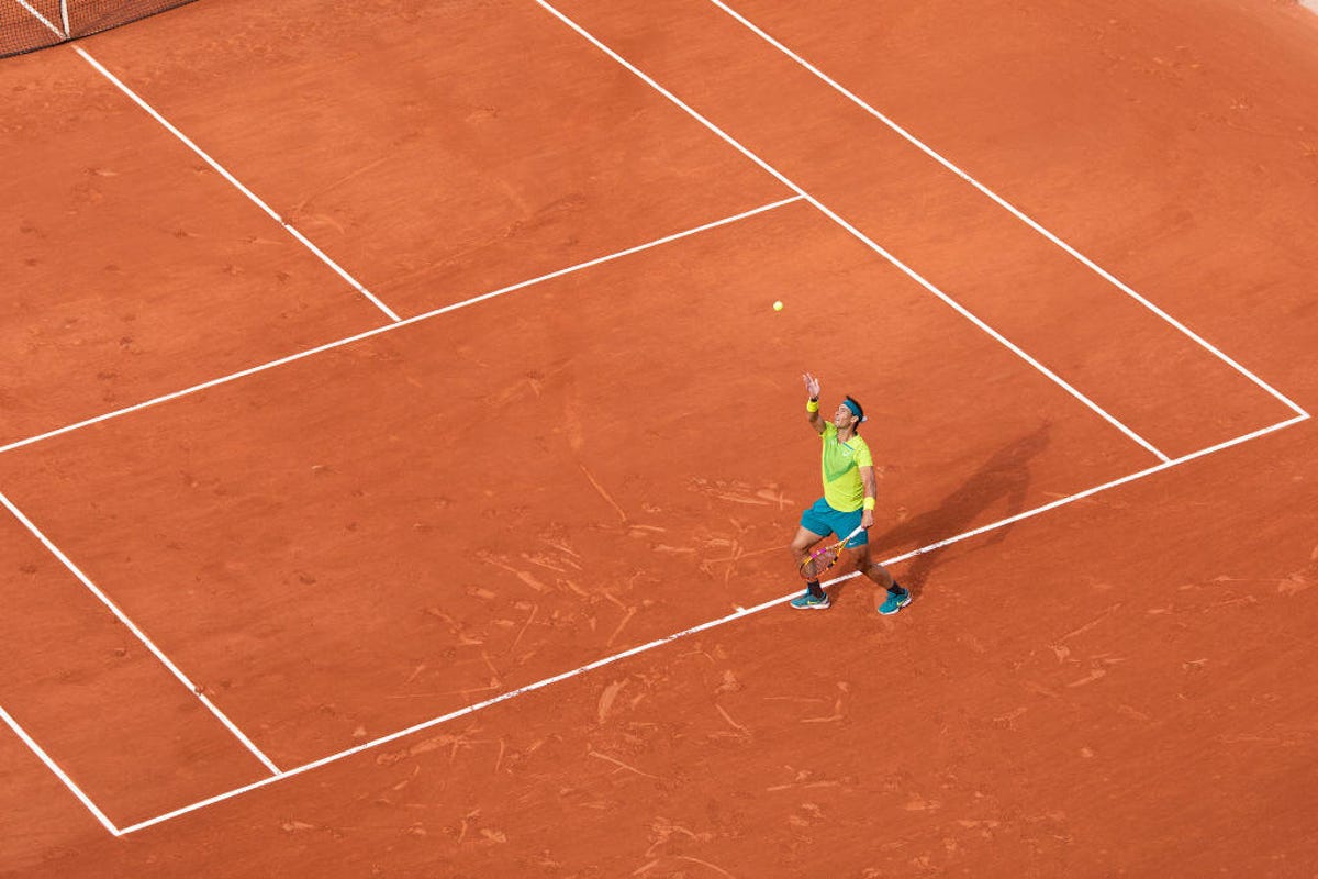 A general view of Rafael Nadal of Spain serving against Felix Auger-Aliassime of Canada on Court Philippe Chatrier during the singles fourth round match at the 2022 French Open Tennis Tournament at Roland Garros on May 29th 2022 in Paris, France