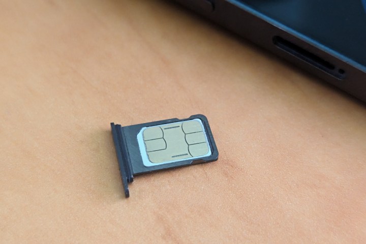 Nano SIM card in SIM card tray from iPhone 14 Pro Max.