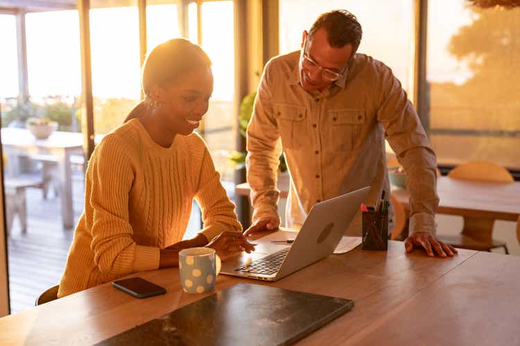 Couple shopping on line together at home