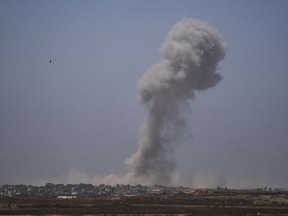 Smoke billows after an explosion in the Gaza Strip, as seen from southern Israel on May 21, 2024.