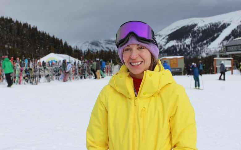 A woman in a yellow ski suit is pictured at Banff Sunshine Ski resort. 