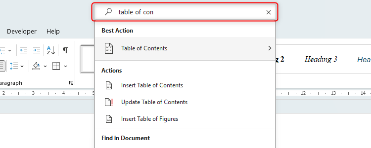 The Microsoft Word search bar with 'Table of con' typed into the bar and the options beneath showing.