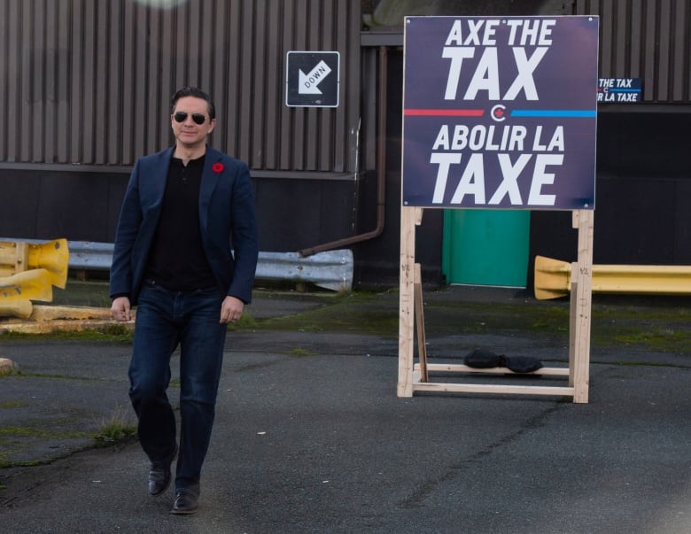 Conservative Leader Pierre Poilievre holds a press conference on his “Axe the Tax” message from the roof a parking garage in downtown St. John’s on Friday, Oct. 27, 2023.