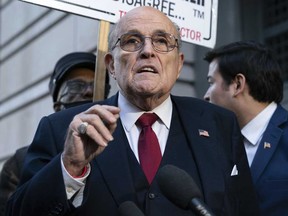 Former Mayor of New York Rudy Giuliani speaks during a news conference outside the federal courthouse in Washington, Dec. 15, 2023.