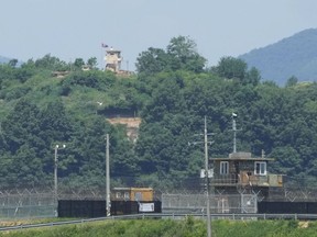 A North Korean military guard post, top, and South Korean post, bottom, are seen from Paju, South Korea, near the border with North Korea, Friday, May 31, 2024. North Korean leader Kim Jong Un supervised firing drills involving nuclear-capable, multiple rocket launchers to show the country's ability to carry out preemptive attacks on rival South Korea, state media reported Friday.