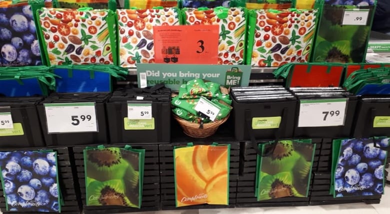 Reusable bags are seen in rows.