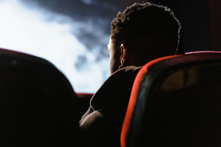 A photo of someone watching a movie in a theater.