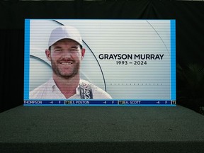 A golf broadcast by CBS is played on an empty stage at the media center showing a photo of Grayson Murray during the third round of the Charles Schwab Challenge golf tournament at Colonial Country Club in Fort Worth, Texas, Saturday, May 25, 2024. Two-time PGA Tour winner Murray died Saturday morning at age 30, one day after he withdrew from the tournament.