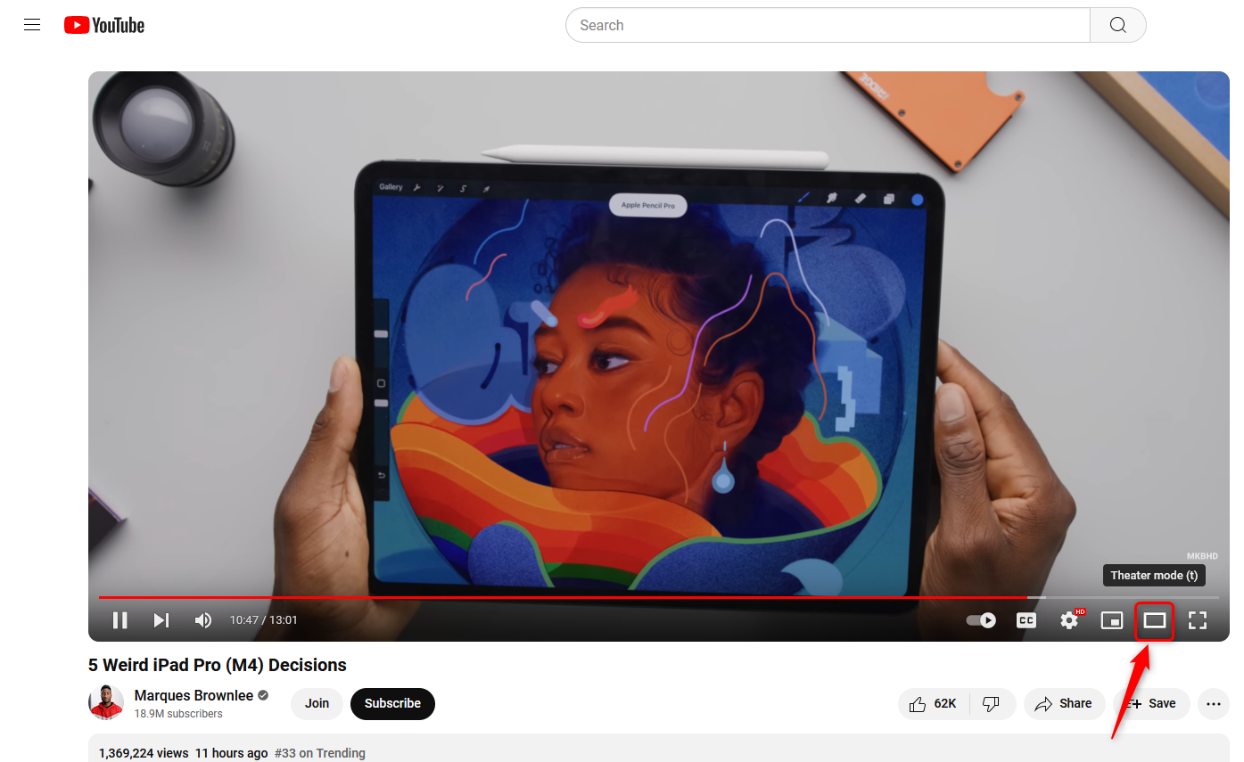 Watching YouTube in a browser with an arrow showing the Theater mode button.
