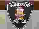 Windsor Police Service insignia on a podium at headquarters.