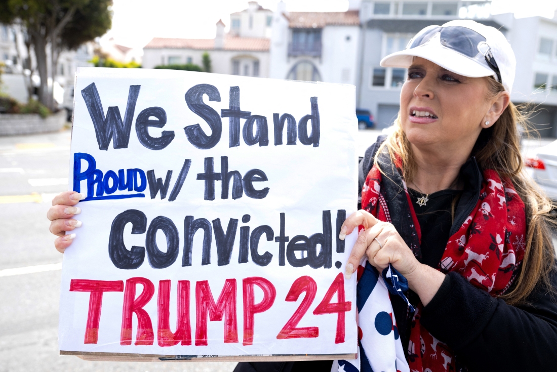 A supporter outside a fundraising event for Donald Trump in San Francisco on Thursday isn't put off by his conviction.