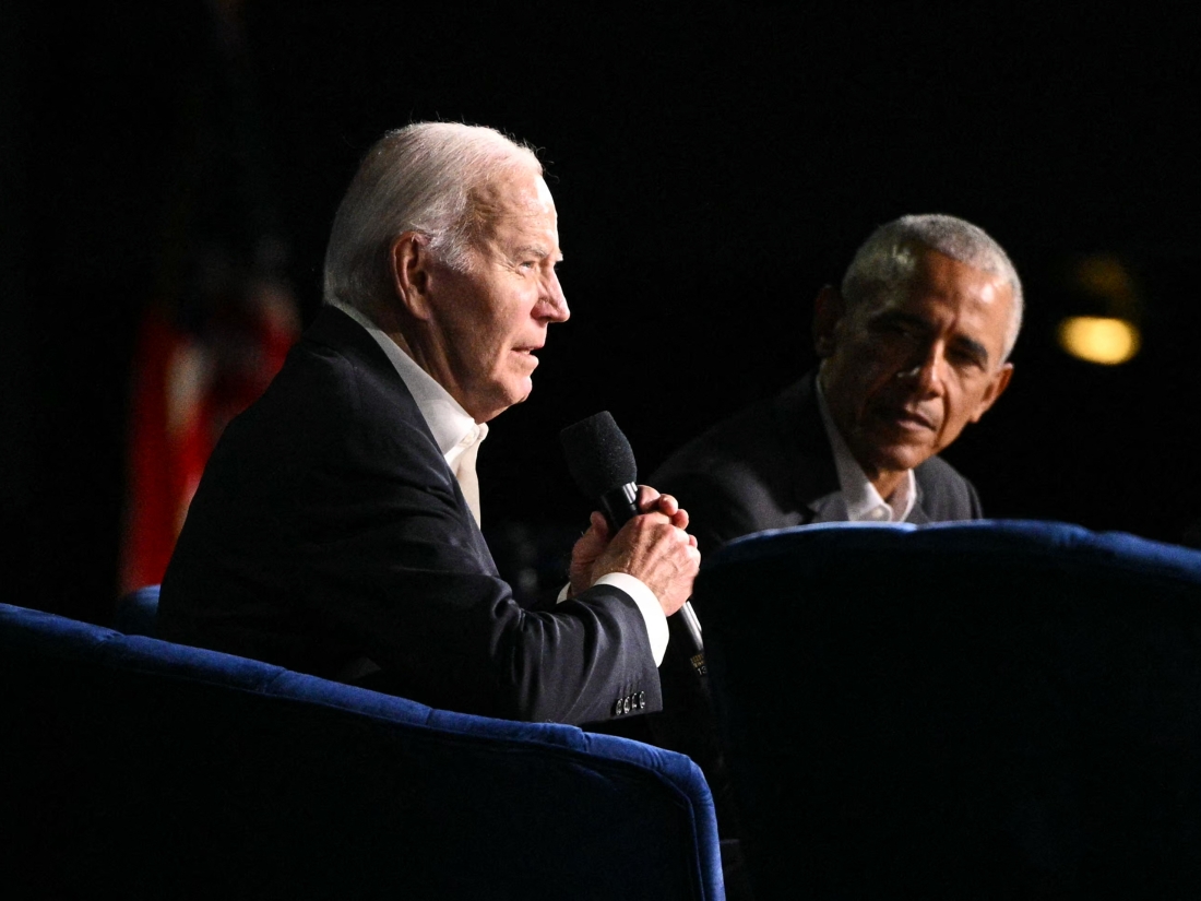 President Biden speaks next to former President Barack Obama onstage during a campaign fundraiser in Los Angeles on June 15,