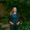 Emily Baden stands in her backyard in San Francisco. Before moving to San Francisco, she was neighbors with Supreme Court Justice Samuel Alito, who she says was a quiet observer to heated exchanges between her and Alito’s wife, Martha-Ann Alito, regarding signs on the Baden family’s front yard.