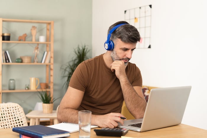 A person at a laptop.