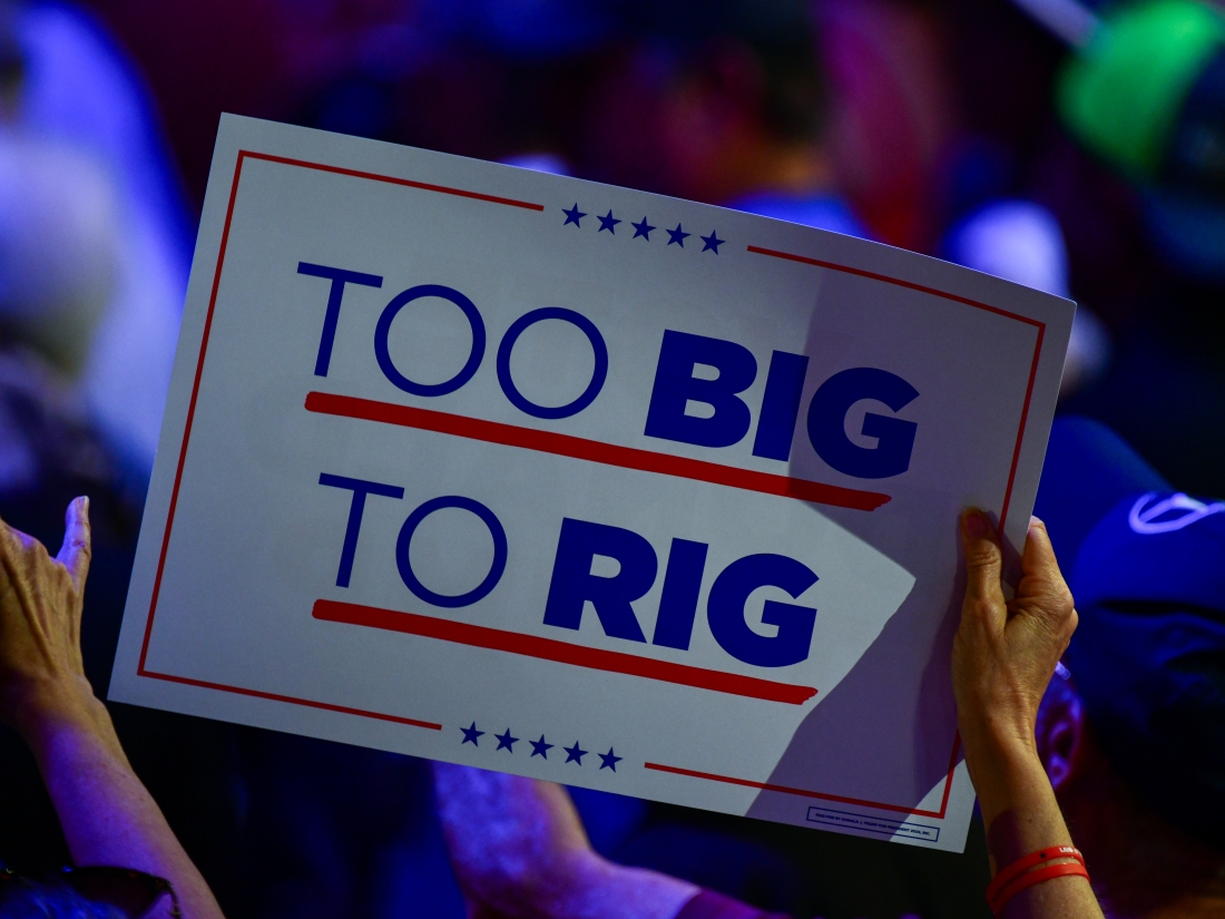 A supporter waves a sign in support of Former President Donald Trump at Dream City Church in Phoenix, Ariz. on Thursday, June 6, 2024.