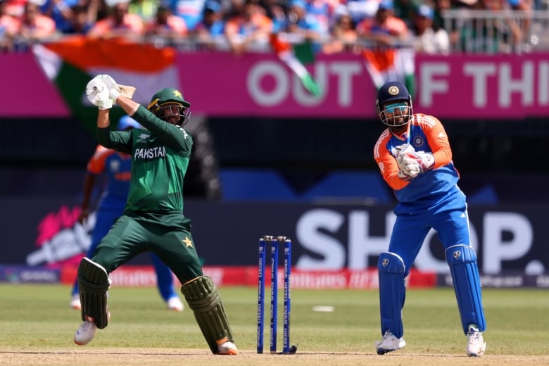 A batsman on a cricket pitch.