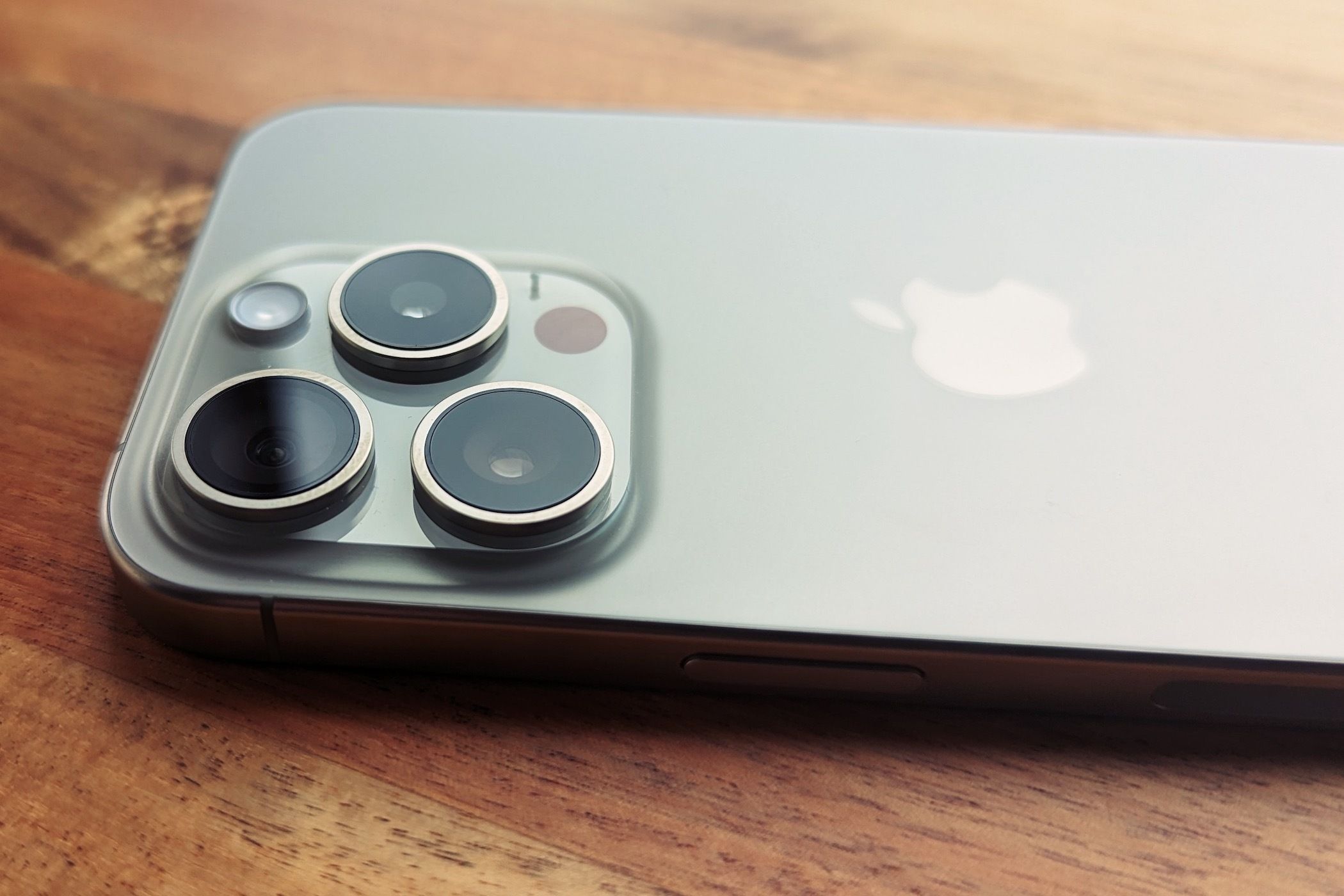 The Apple iPhone 15 Pro's three lens camera system.