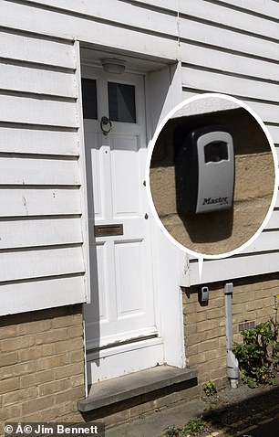 Lockboxes on cottage doors in Whitstable indicate their use as Airbnb properties