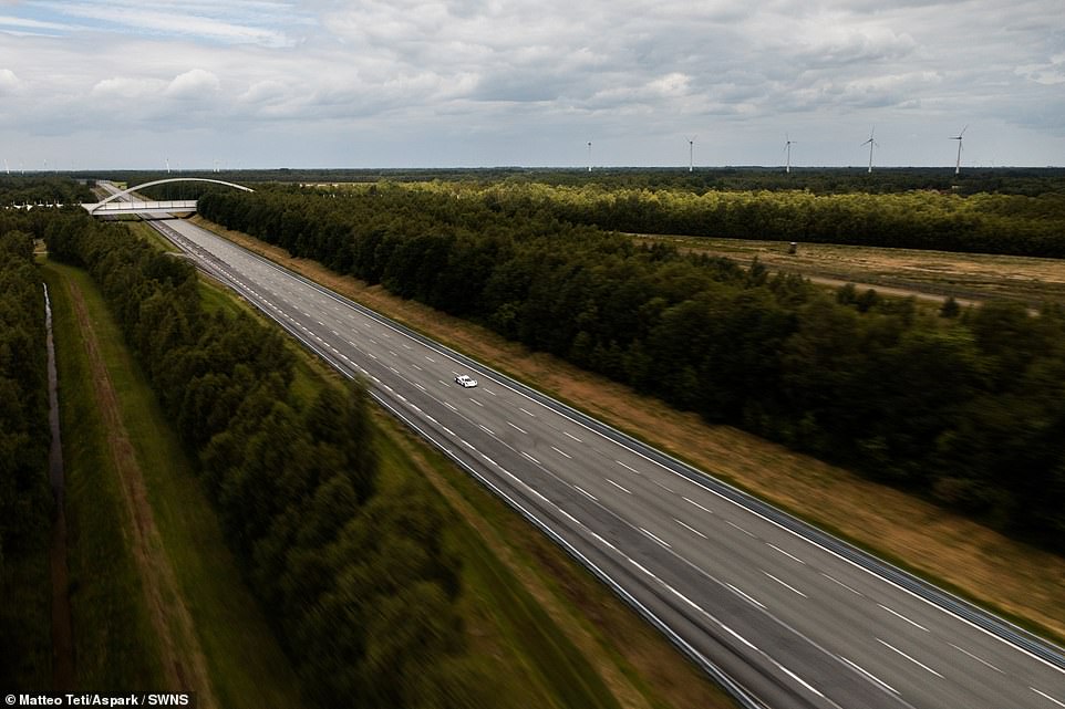 The German test track is made up of an oval circuit 7.6 miles long with four lanes. The two straights are 2.5 miles long while the pair of banked curves are 1.3 miles each and have an incline angle of 49.7 degrees. This makes it possible to negotiate curves at speeds of up to 155mph without lateral forces