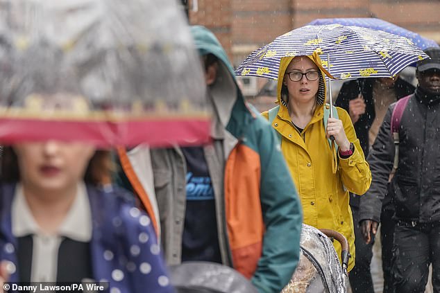 Damp days: Wet weather and lower inflation led to take-home supermarket sales rising at their slowest pace for two years, according to new figures from Kantar