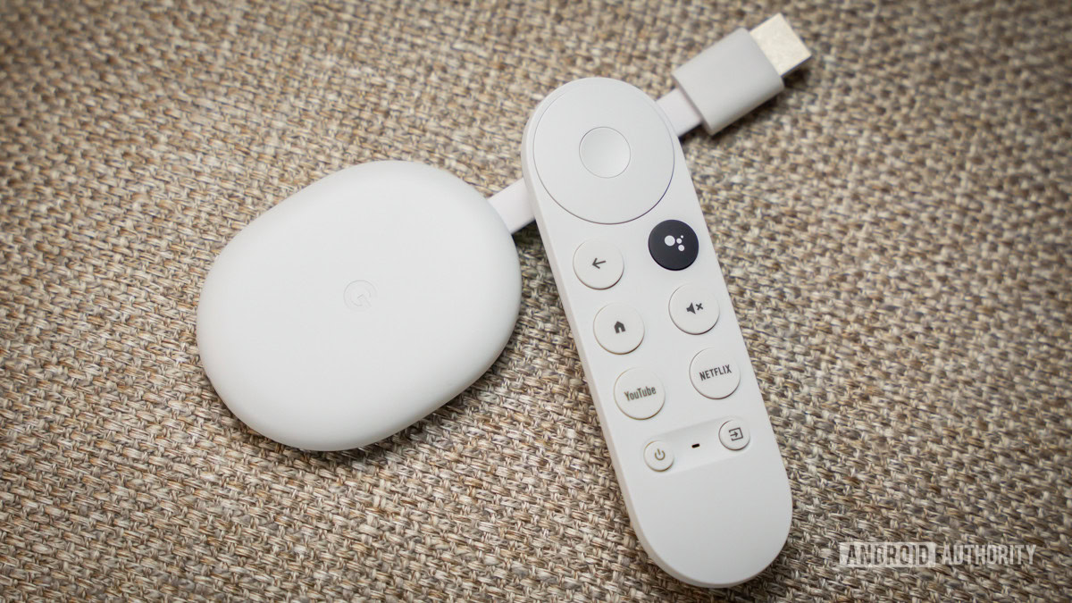 Chromecast with Google TV HD next to remote 4