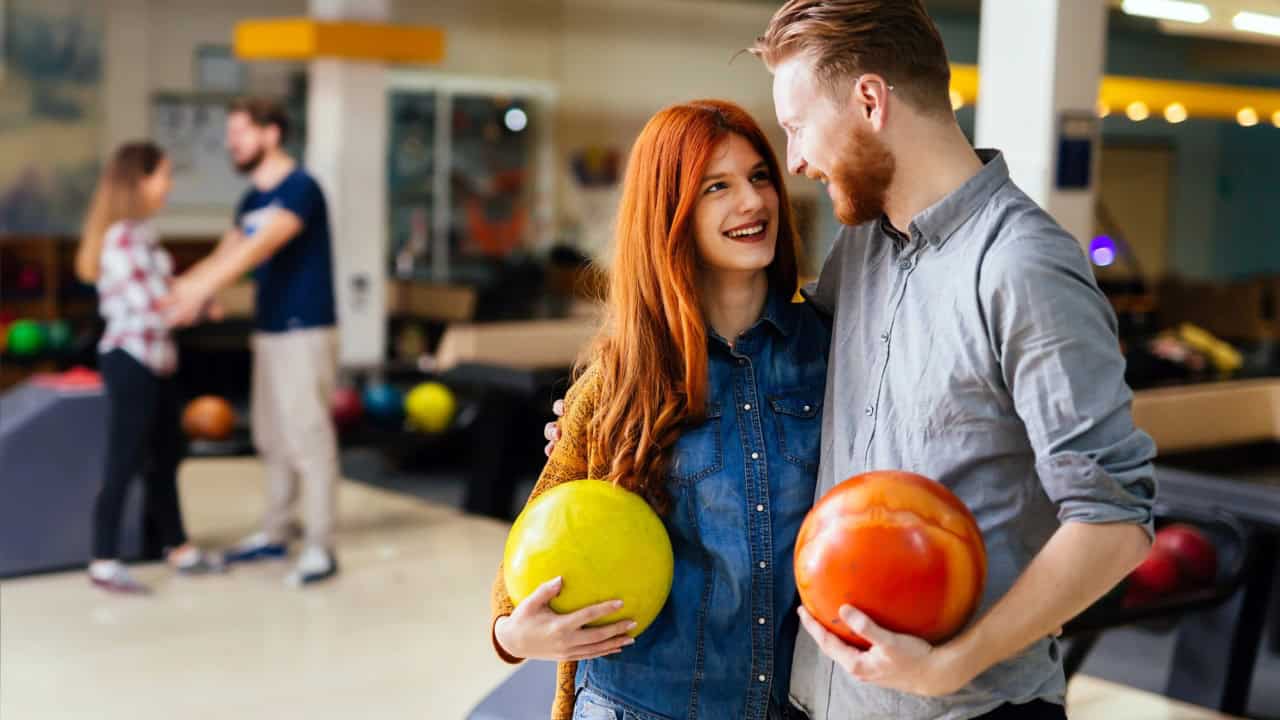 Beautiful couple dating and bowling