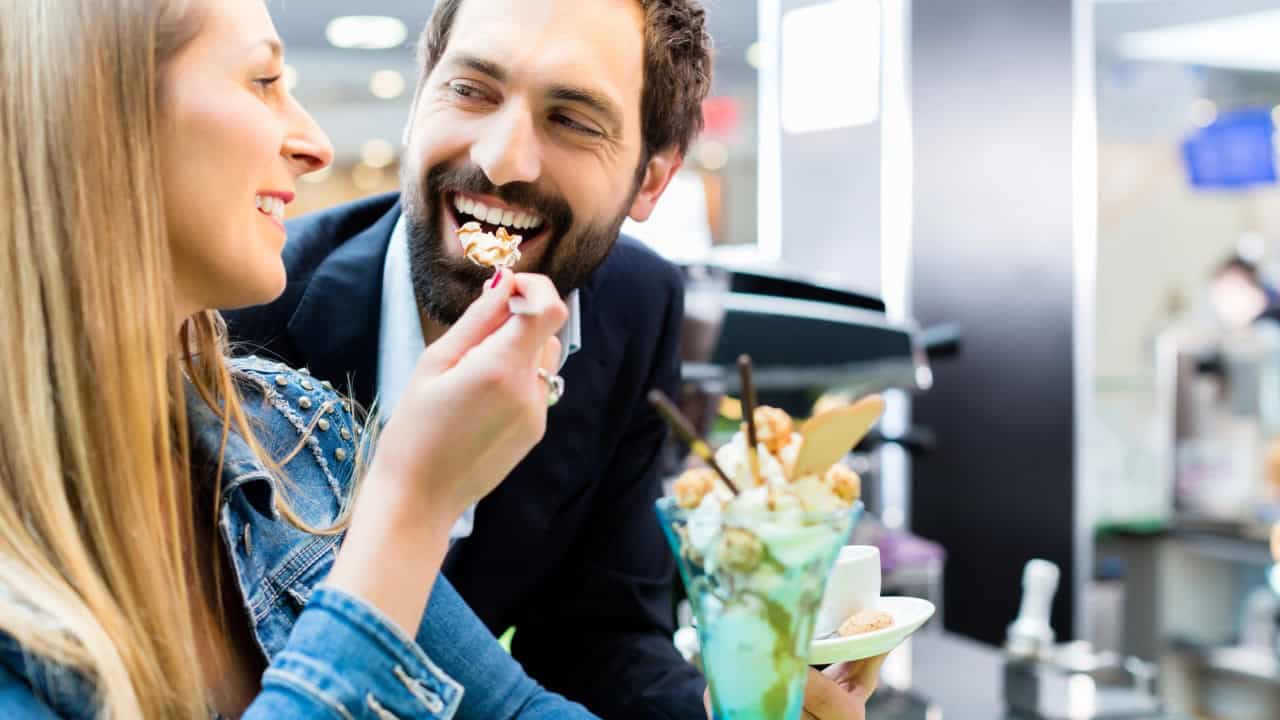 Couple enjoying an ice cream sundae