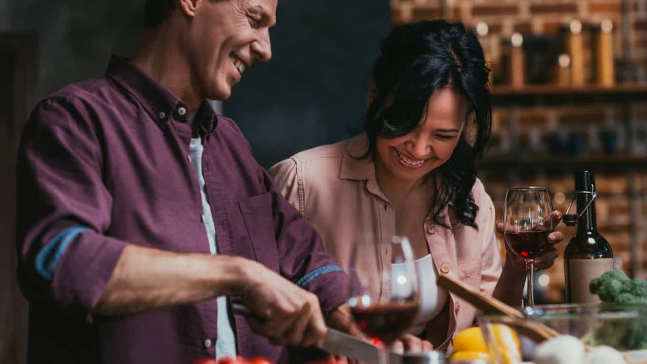 Couple cooking dinner