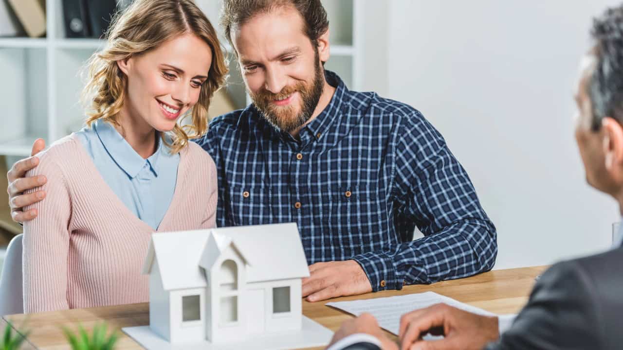 Couple at real estate agency