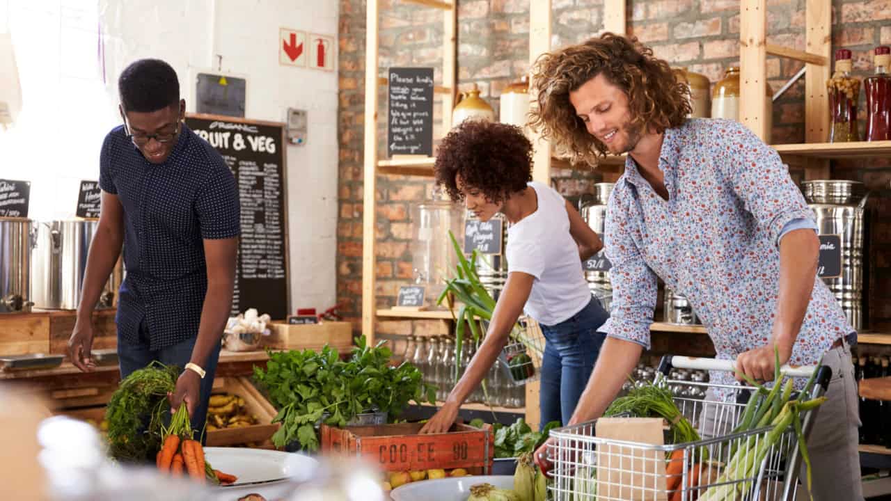 Shoppers Buying Fresh Fruit And Vegetables In Sustainable