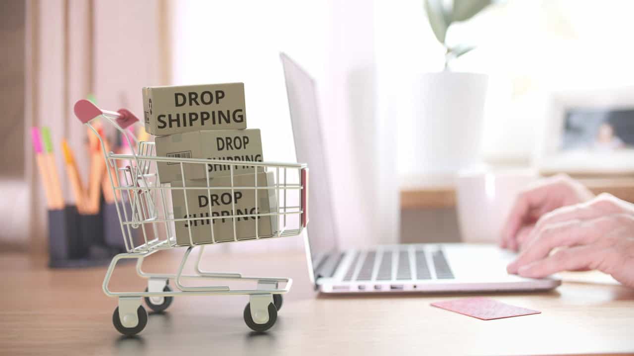 Cartons with DROPSHIPPING text fall in shopping cart