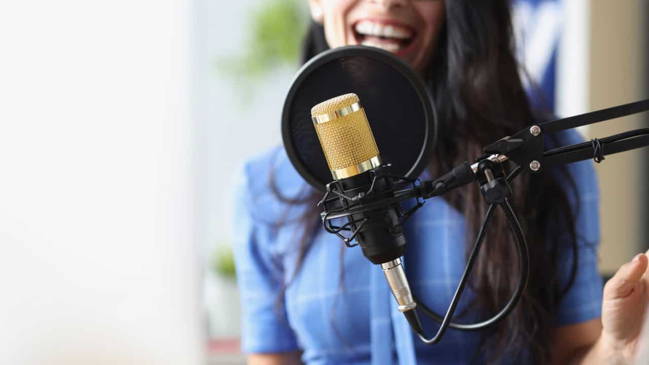 Studio black microphone in background woman