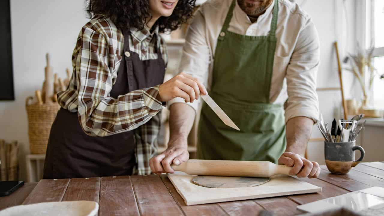 couple at pottery studio crafts