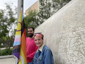 Saskatoon Pride board members Graham Pyett and Blake Tait prepare to raise the Pride Flag at Saskatoon City Hall on June 17, 2024.