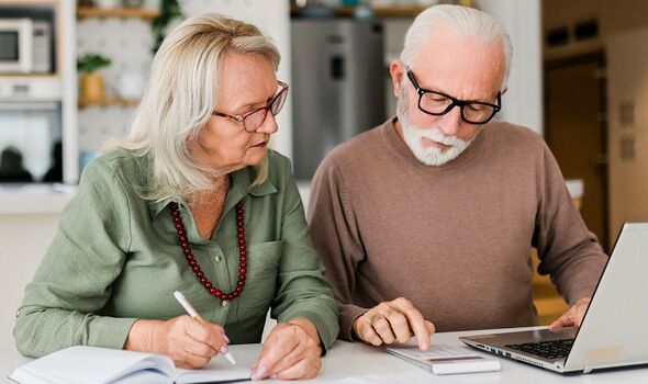 A couple check their bills