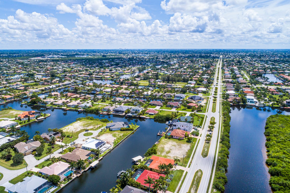 aerial view of South Spreader Waterway Canal, aquatic nature preserve and surrounding homes in Cape Coral