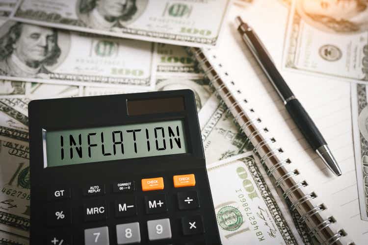 INFLATION word on calculator in idea for FED consider interest rate hike, world economics and inflation control, US dollar inflation